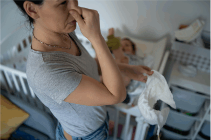 changing a baby diaper, conquer diaper trash odors