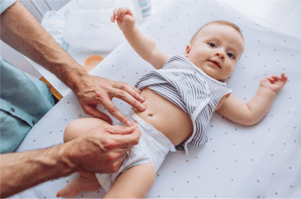 changing a baby diaper, conquer diaper trash odors