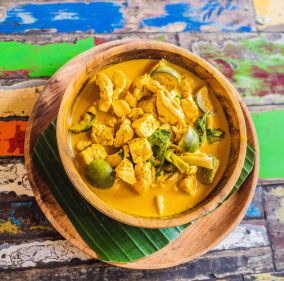 A bowl of warm lemongrass and coconut curry. top 3 dishes infused with lemongrass